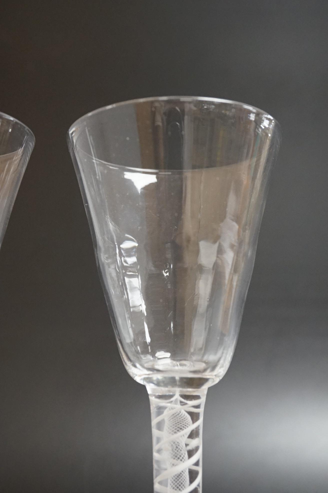 A near pair of opaque twist wine glasses, c.1760, 17.3cm high